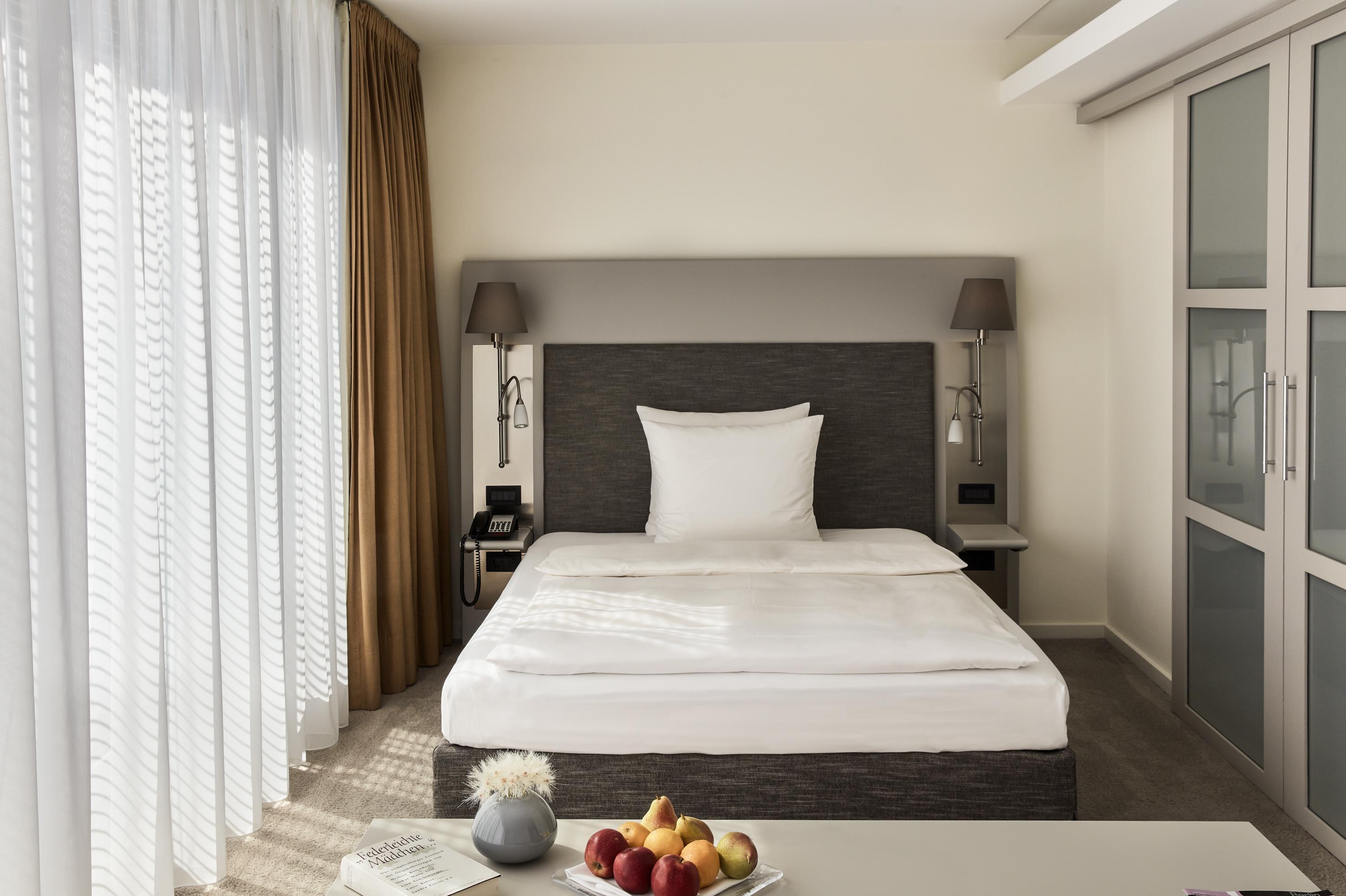 더 만다라 호텔 베를린 외부 사진 A bedroom at the hotel